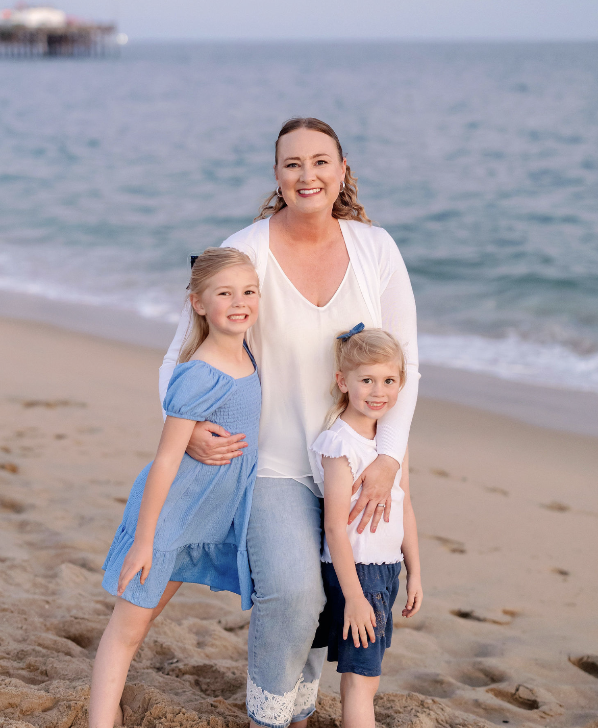 Annie with her family at the San Diego coast